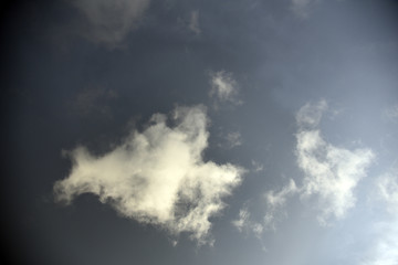 white clouds on black background.