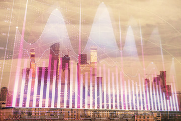 Double exposure of financial graph on downtown veiw background. Concept of stock market research and analysis