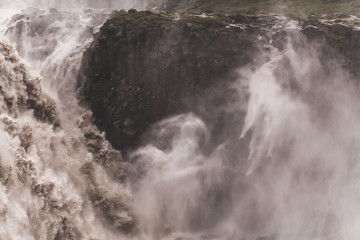 Dramatic view of famous Iceland waterfall Dettifoss. Breathtaking landscape, stream of water, most powerful waterfall in Europe.