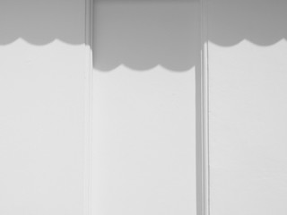 shadow of curtain on white wall
