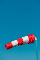 windsock in front of blue sky