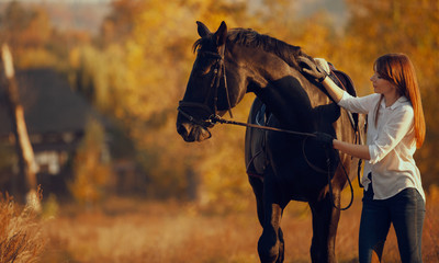 Young girl riding a horse.
