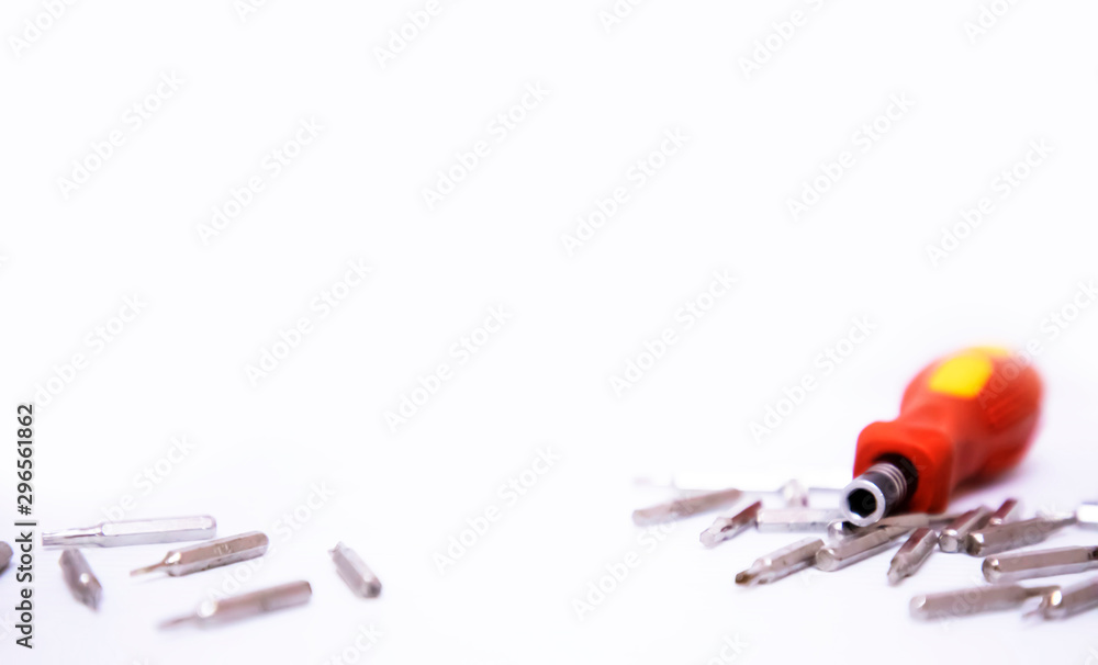 Wall mural yellow and red hand screwdrivers and screws isolated on white background.