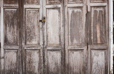 Old antique wooden doors in rural Thailand.