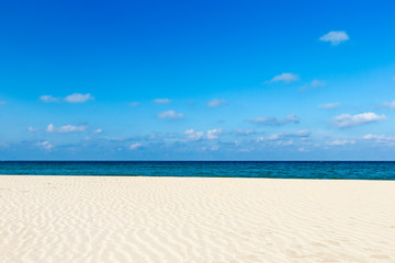 Sea view from tropical beach with sunny sky.