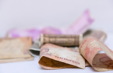 Indian currency bank notes of 5 and 10, 20, 500, 2000 rupees on white background with space for text