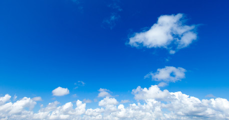 white fluffy clouds in the blue sky