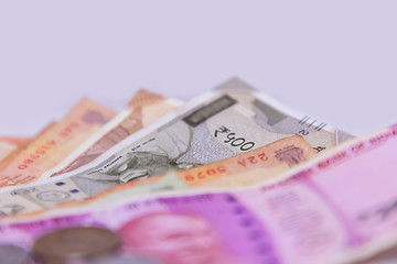 Close up of Indian 2000, 500 rupee notes, white background with space for text