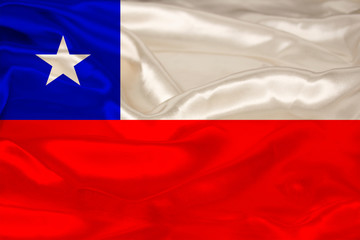photo of the beautiful colored national flag of the modern state of Chile on textured fabric, concept of tourism, economics and politics, close-up