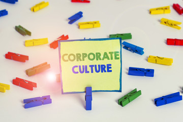 Conceptual hand writing showing Corporate Culture. Concept meaning pervasive values and attitudes that characterize a company Colored clothespin papers empty reminder white floor office