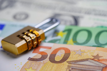 Golden security digital password lock key on Euro banknotes : Finance security concept..