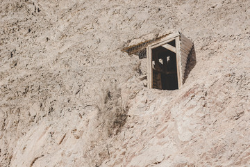 third world country in Middle East region wooden booth hole entrance to  someone's Bedouin home in...