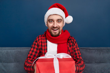 Friendly male giving Christmas presents