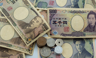 Japanese yen notes and Japanese yen coins for money concept background