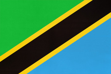 Republic Tanzania national fabric flag textile background. Symbol of world african country.