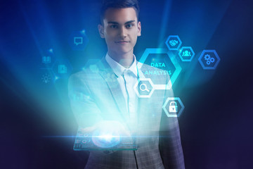 The concept of business, technology, the Internet and the network. A young entrepreneur working on a virtual screen of the future and sees the inscription: Data analysis