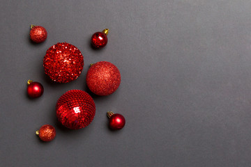 Top view of Christmas balls and creative decorations on colorful background with copy space. New Year concept