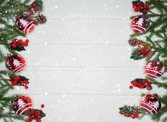 Obraz na płótnie Canvas christmas decoration and garland lights on white wooden background