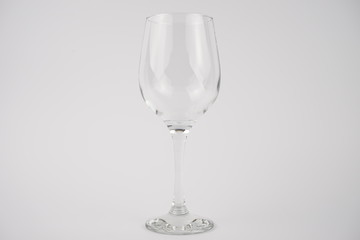 centred empty glass of wine on isolated white background
