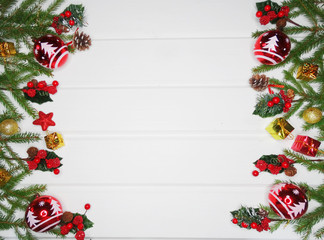 christmas decoration and garland lights on white wooden background