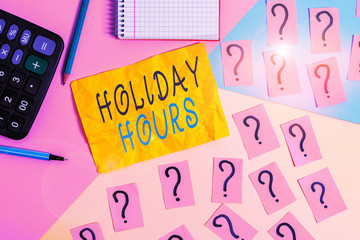 Writing note showing Holiday Hours. Business concept for employee receives twice their normal pay for all hours Mathematics stuff and writing equipment above pastel colours background