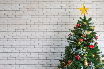 Christmas tree with red gifts in the white room Christmas