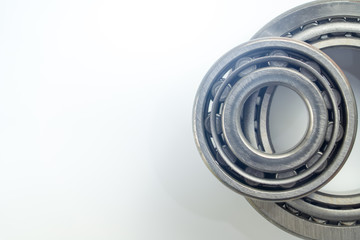Ball bearing and Taper bearing on white background.