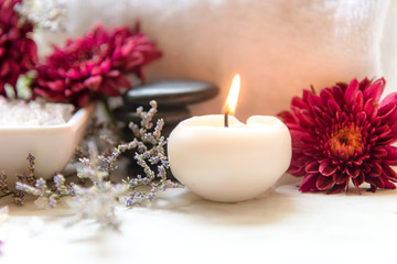 Obraz na płótnie Canvas Thai Spa Treatments aroma therapy salt and sugar scrub and rock massage with red flower with candle for relax time. Thailand. Healthy Concept. copy space