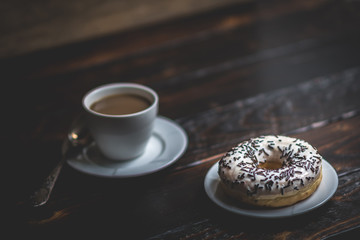 White donut with chocolate sprinkle