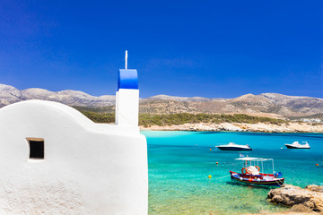 Traditional authentic Greece. Beautiful beach and church in Naxos island - obrazy, fototapety, plakaty