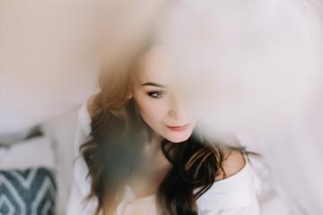 portrait of a young beautiful woman with dark hair. Beautiful young brunette posing in the studio. Romantic shot