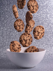 chocolate chips falling on bowl