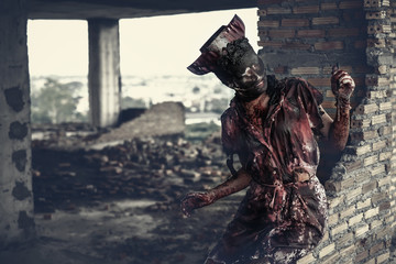 Ghost nurse woman or zombie holding the knife with resentment and malice in the building abandoned...