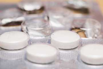 pills in a pack. white pills.