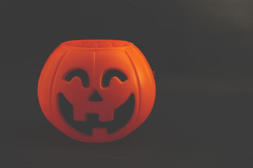 Halloween pumpkin on dark background with space for text