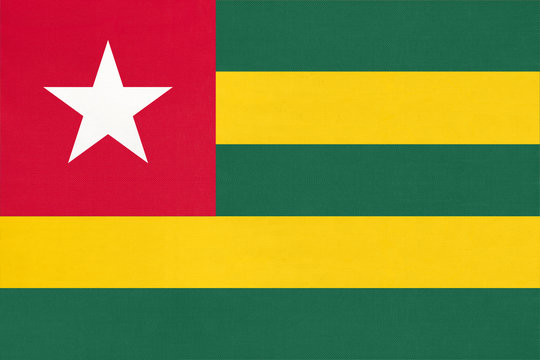 Republic Togolese national fabric flag textile background. Symbol of world african country.