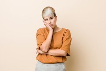 Obraz premium Young plus size woman with short hair who is bored, fatigued and need a relax day.