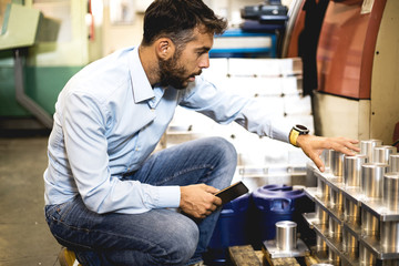 The engineer oversees the process of working in an electrical workshop,stock photo