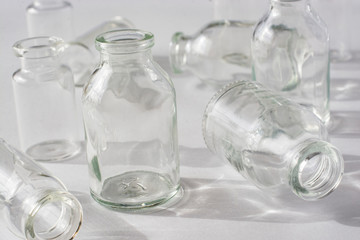 Empty glass medical vials closeup.