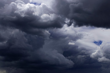 Obraz premium Dark sky, white fluffy and rainy dark clouds before rain.