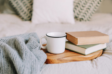 Books and coffee cup. Breakfast in bed.  Good morning. Atmospheric hygge style. flat lay, still life
