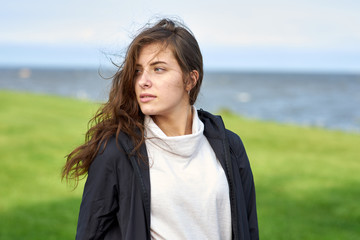 portrait of young woman on the background of blue sky