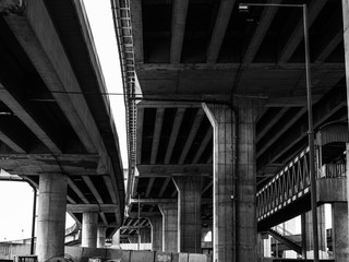 Black and white picture under the expressway bridge