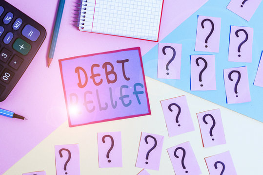 Handwriting text Debt Relief. Conceptual photo partial or total remission of it especially those by countries Mathematics stuff and writing equipment above pastel colours background