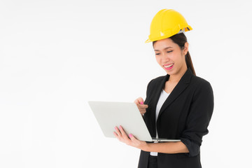 Asian young beautiful woman engineers wearing a black suit and Yellow Safety helmet Standing to work with a computer notebook isolated on white background