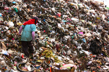Poor people find or searching garbage for sell to reuse and recycle in landfill. This life and...