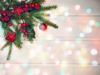 christmas decoration and garland lights on white wooden background