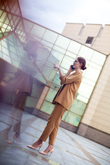 Portrait of smiling businesswoman talking on mobile phone