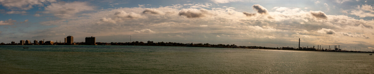 Fototapeta na wymiar Port Huron Michigan in Panoramic format wide angle to show the industrial skyline. Nice autumn day