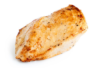Whole pan roasted chicken breast isolated on white.